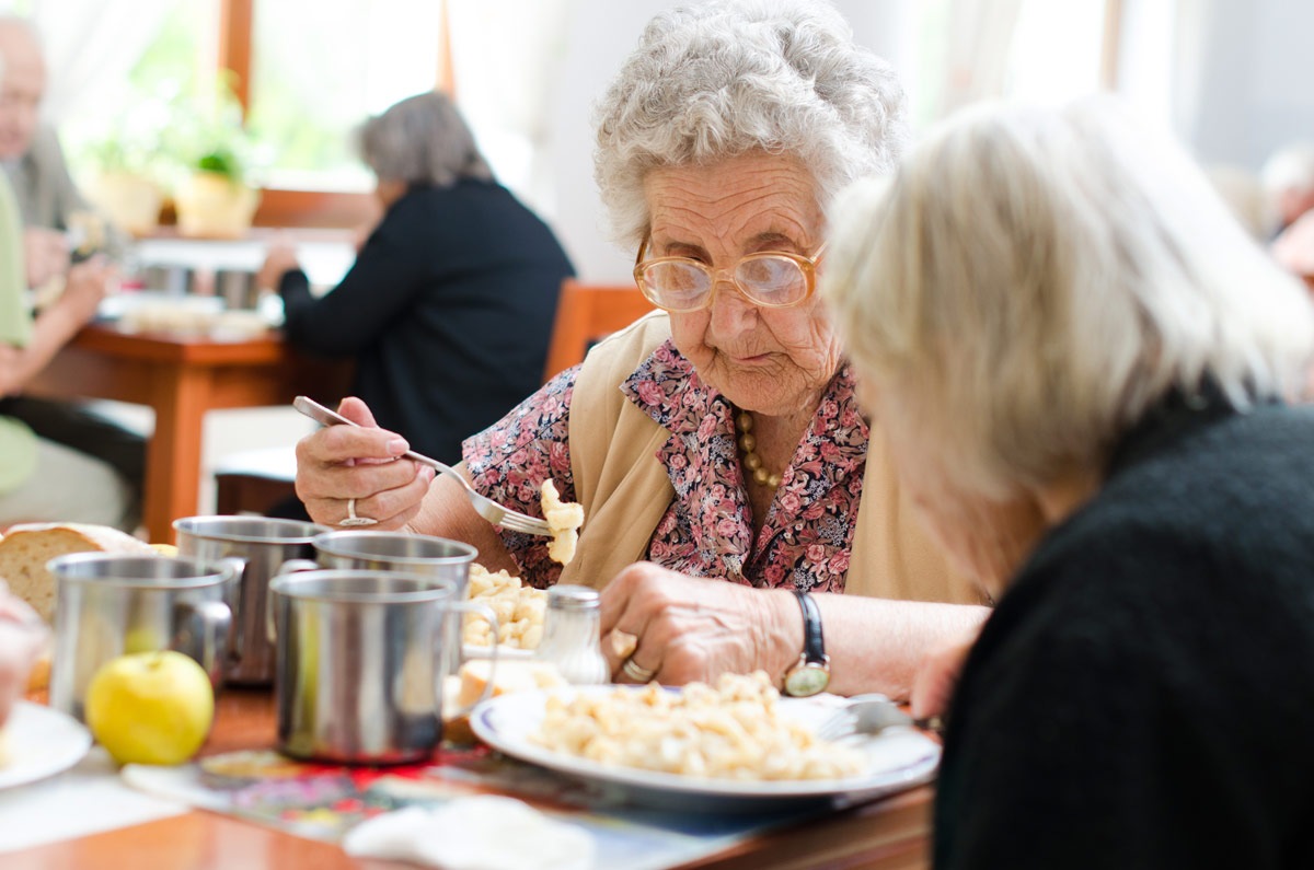 Senior Eating a Meal at Edmonton Seniors Independent Living Community