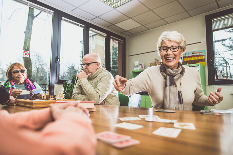 Seniors playing games at independent or assisted living community in Edmonton